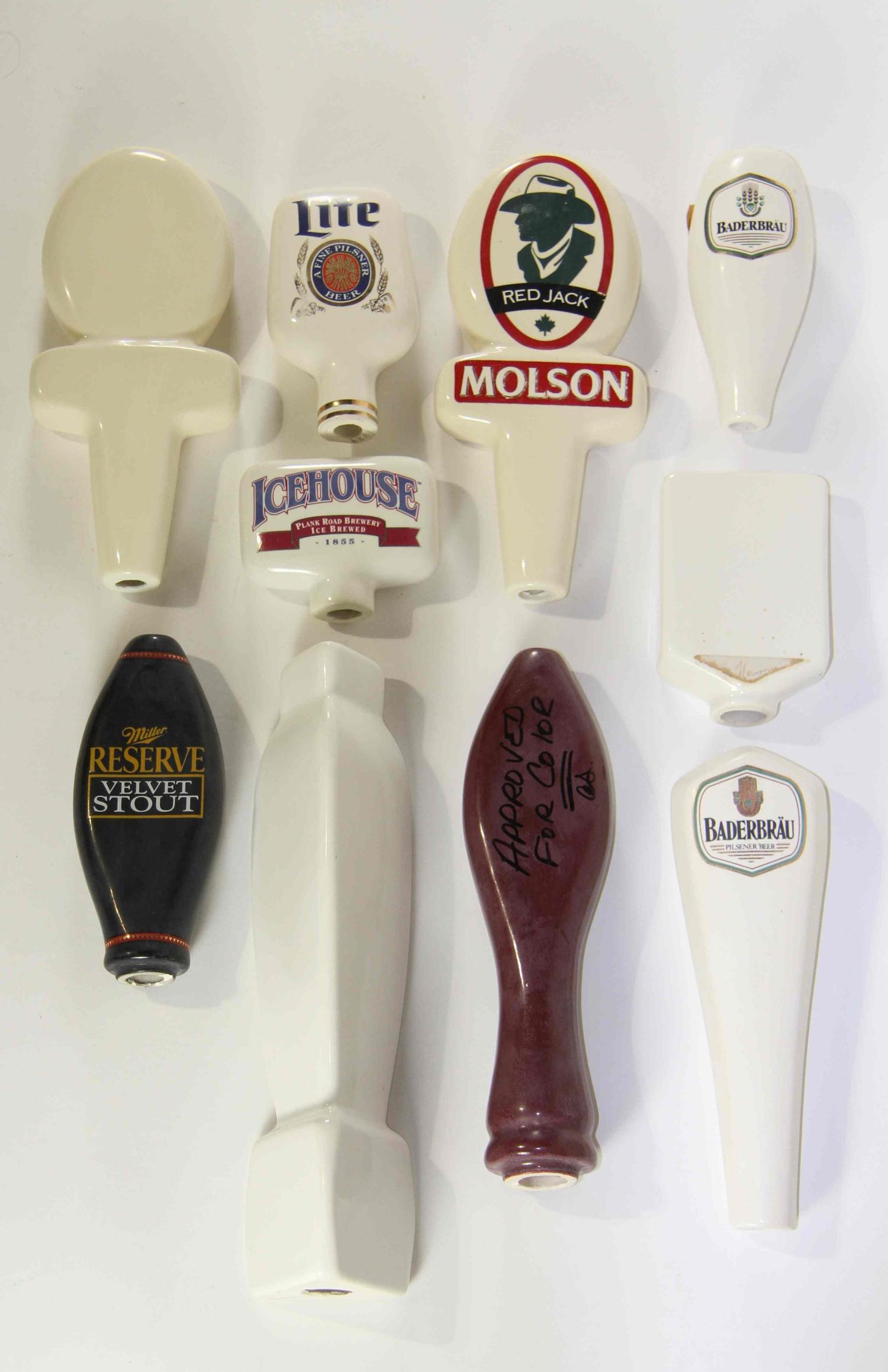 A Collection of Eighteen Haeger Pottery Beer Taps Height of tallest 10 3/4 inches.