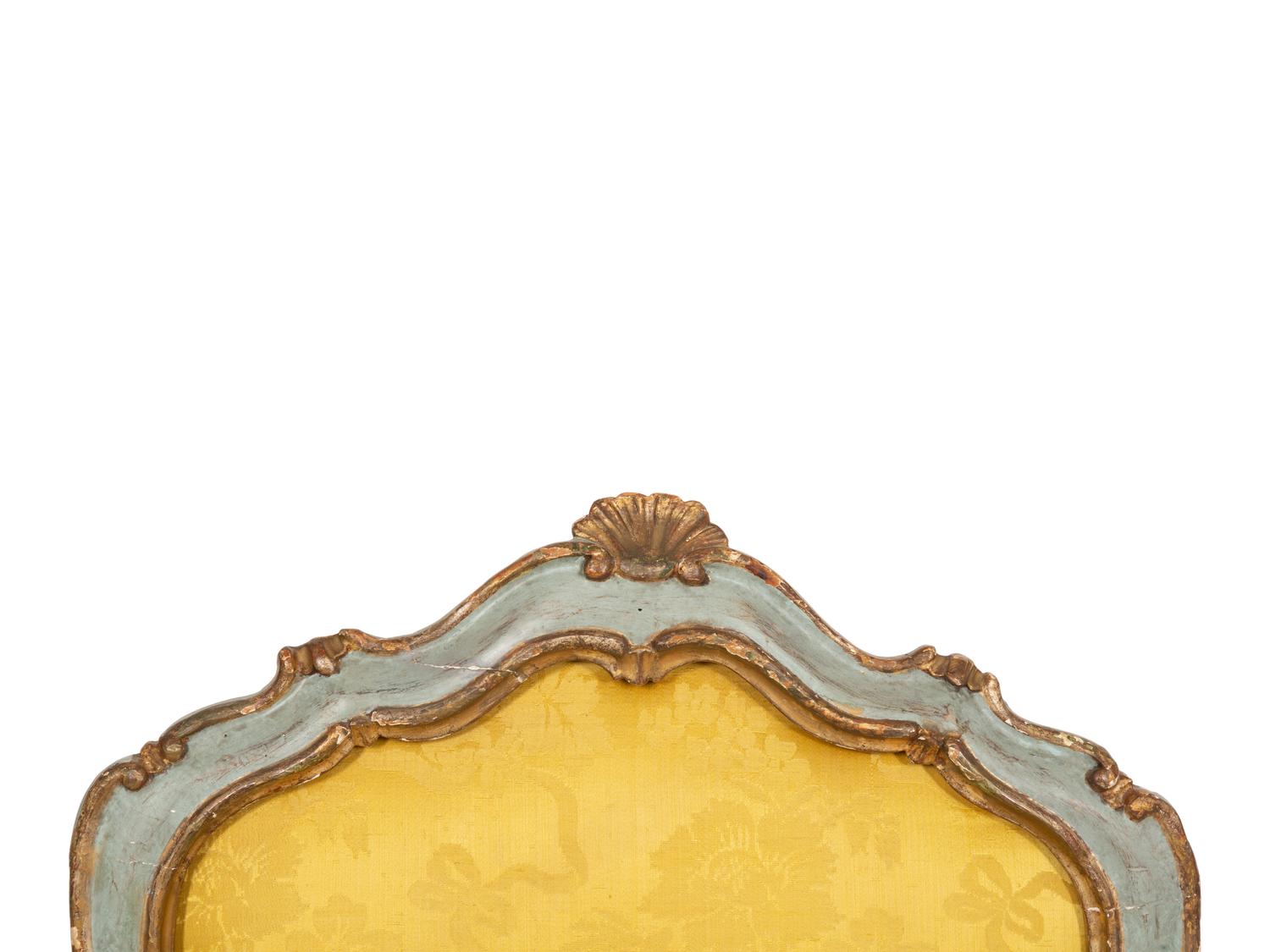 An Italian Rococo Painted and Parcel Gilt Open Armchair