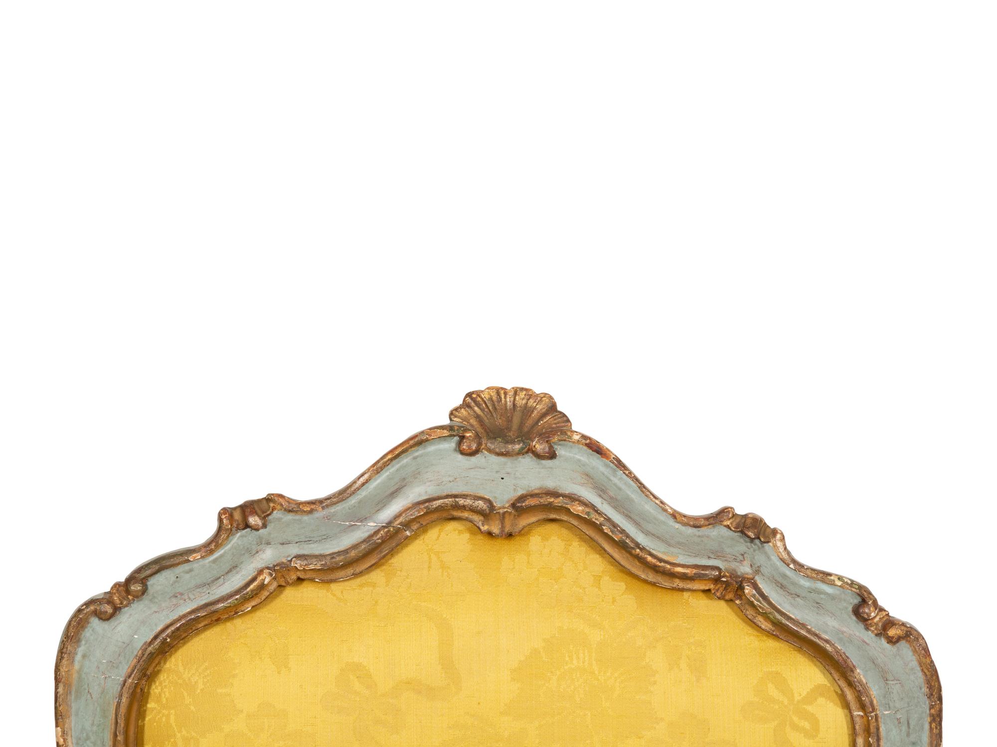 An Italian Rococo Painted and Parcel Gilt Open Armchair