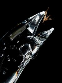 A Steuben Glass and 18K Gold Trout and Fly Figure
