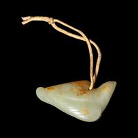 A Chinese Russet and Celadon Jade Carving of a Bird, Possibly Ming Dynasty 明 青白玉鳥