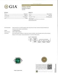 An emerald, diamond, and eighteen karat white gold ring