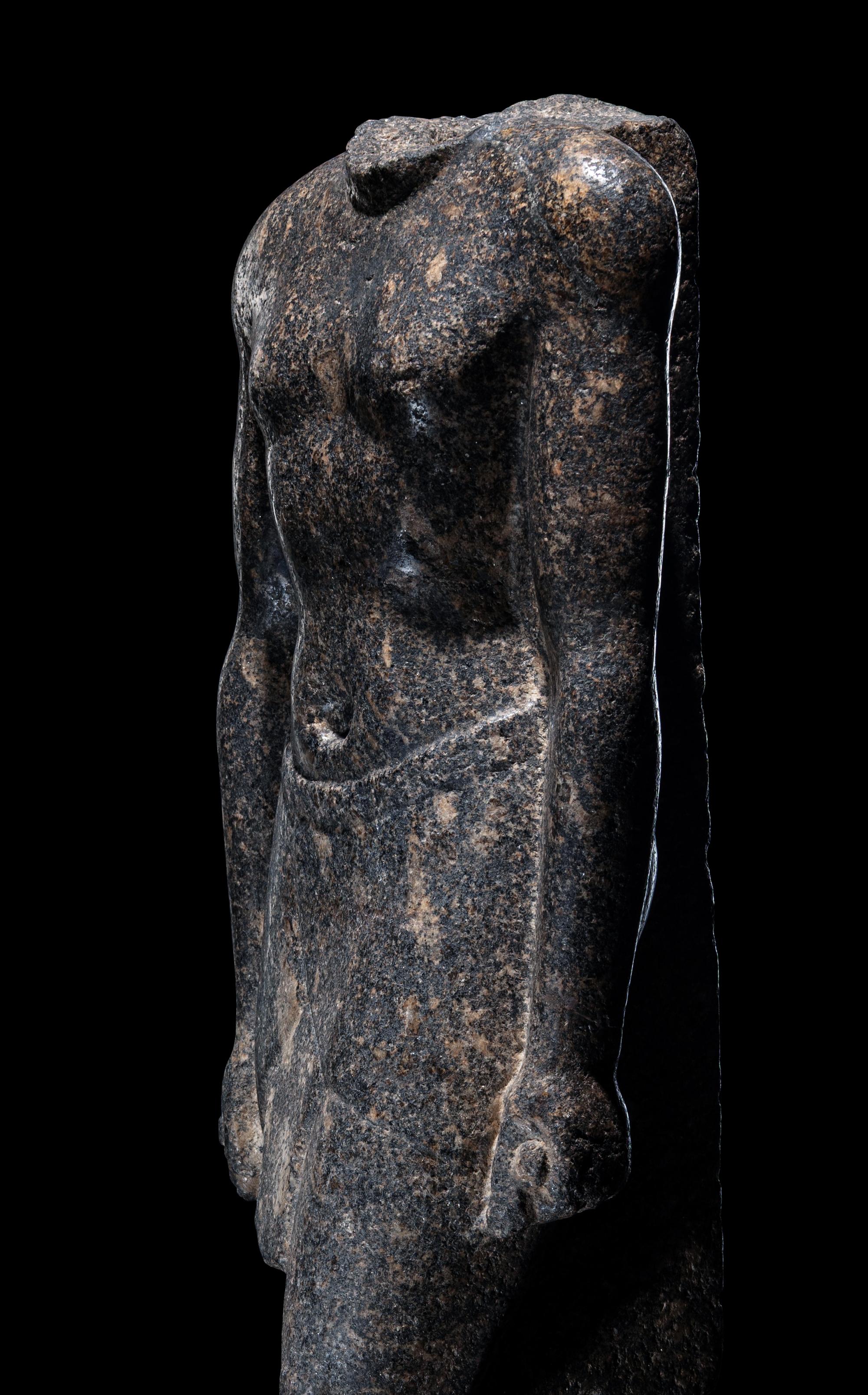 An Egyptian Granite Torso of an Official