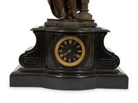 A French Black Marble and Cast Metal Figural Mantel Clock