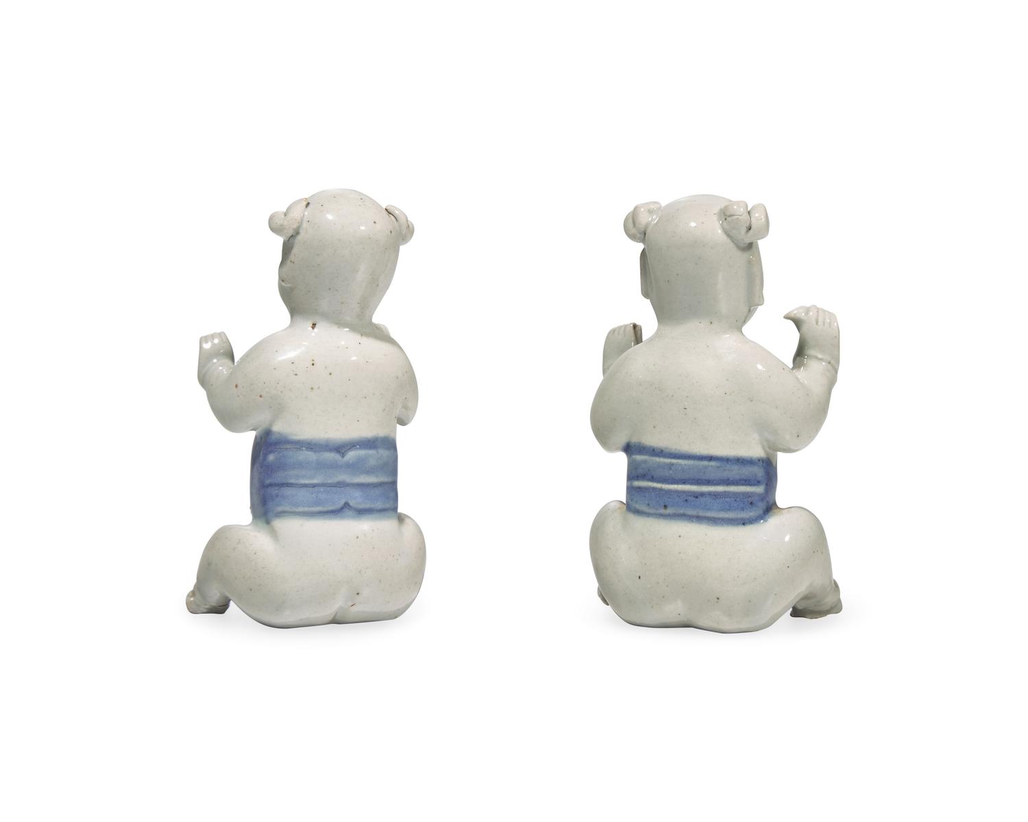 A Pair Of Chinese Porcelain Laughing Boys In Blue And White