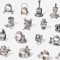 A collection of thirty-four Victorian silverplated and pewter napkin holders Various American and Canadian makers, Connecticut, Massachusetts, and Ontario, late 19th century