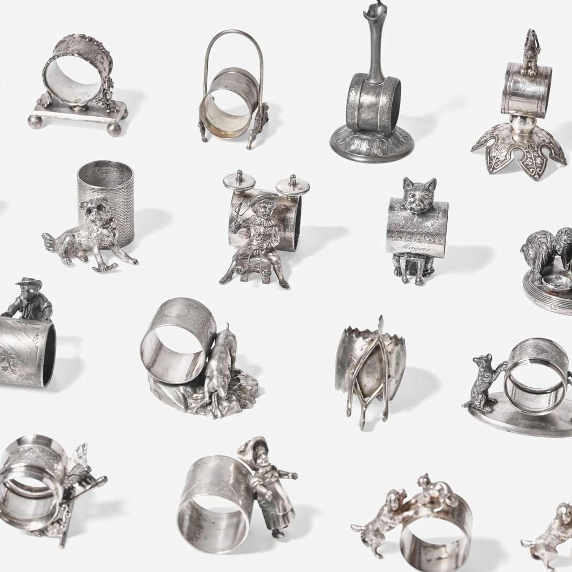 A collection of thirty-four Victorian silverplated and pewter napkin holders Various American and Canadian makers, Connecticut, Massachusetts, and Ontario, late 19th century