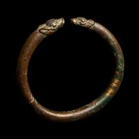An Achaemenid or Lydian Bronze Bracelet with Calf-head Terminals