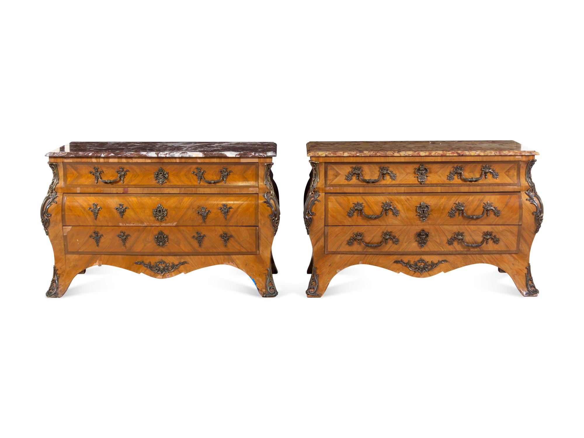 A Pair of Régence Style Bronze Mounted Marble-Top Commodes
