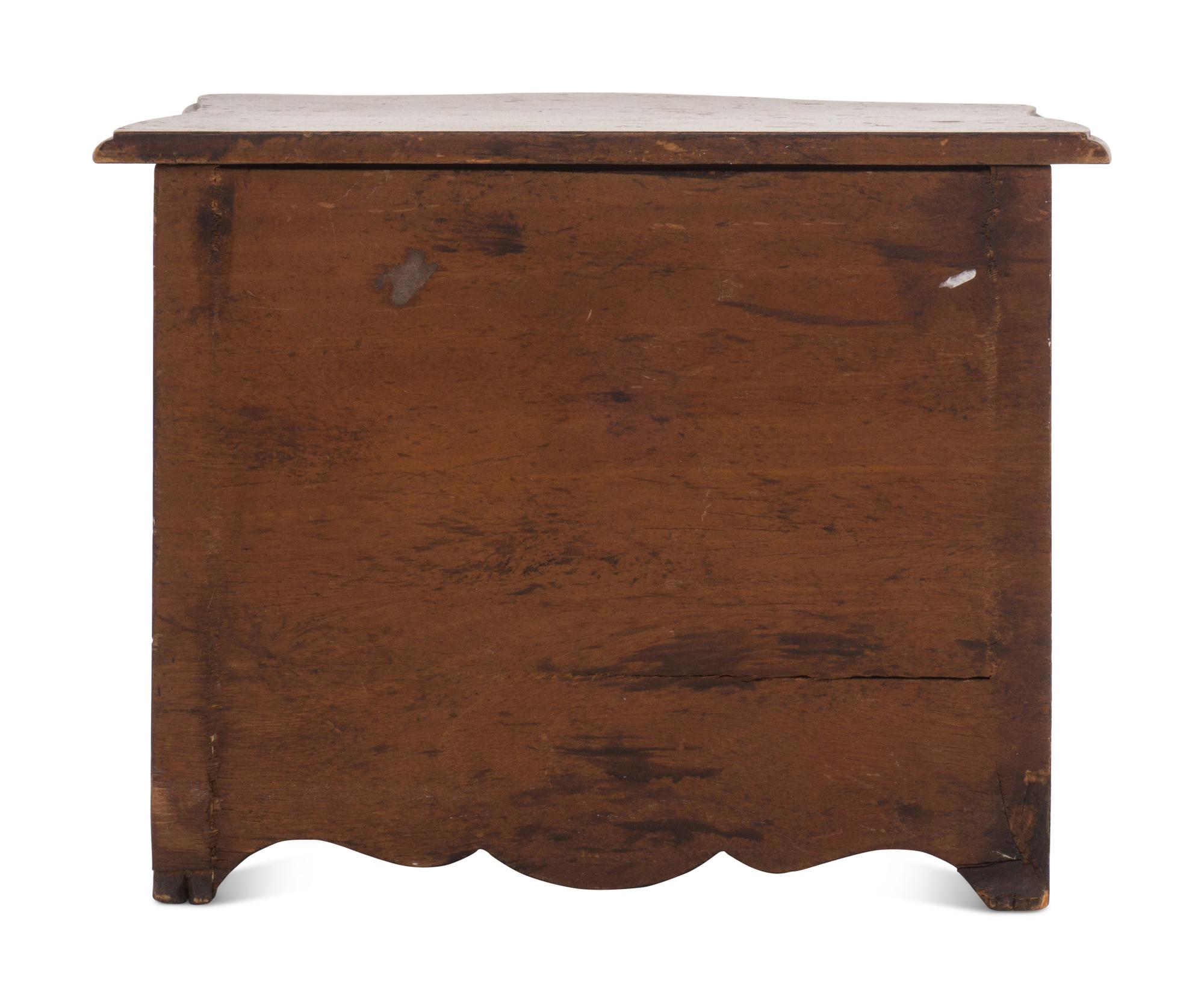 A Louis XV Style Walnut Diminutive Commode