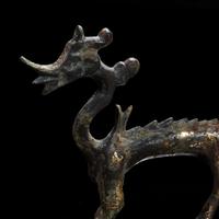 A small Chinese gilt-bronze figure of a striding dragon 铜鎏金行龙 Six dynasties to Tang dynasty ????