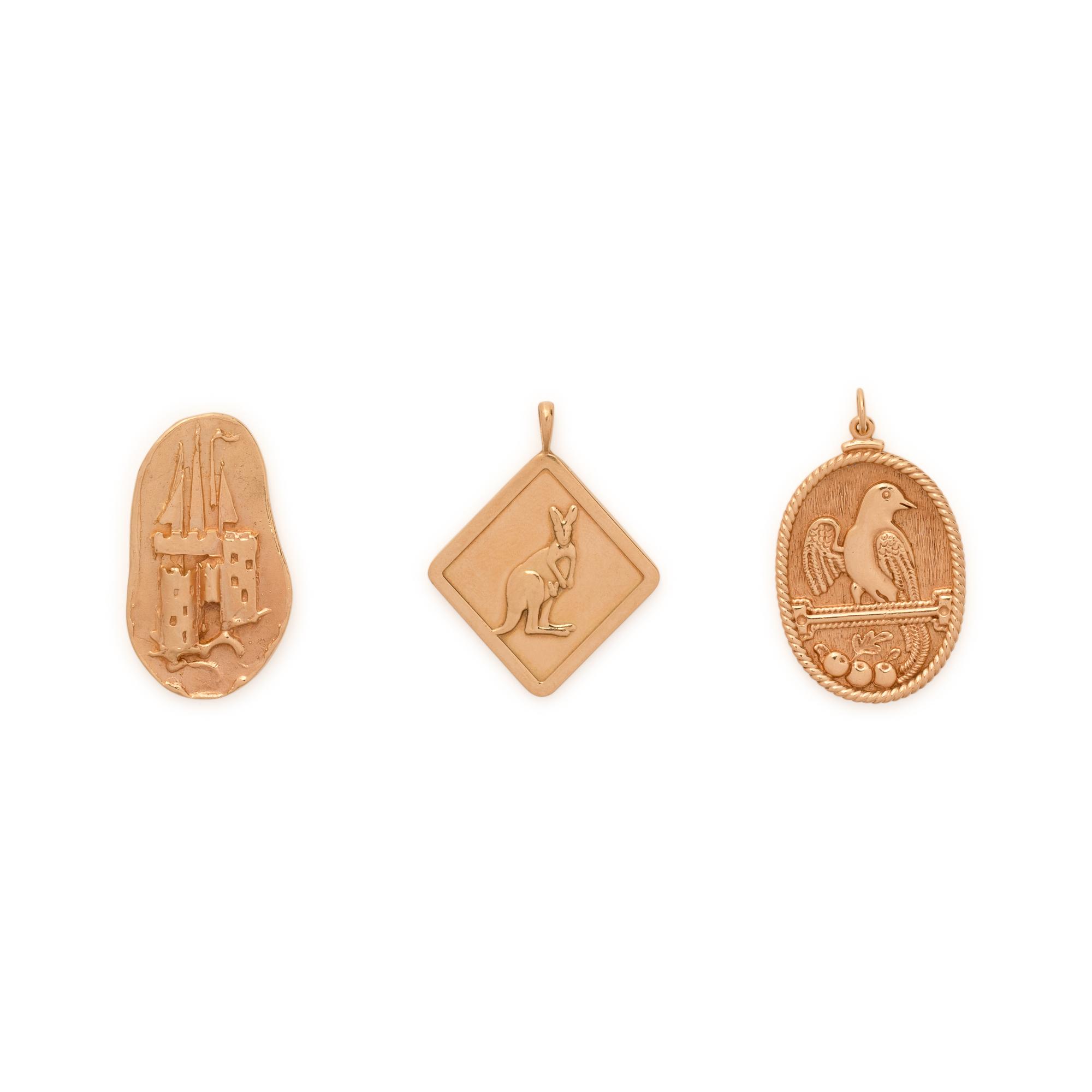COLLECTION OF YELLOW GOLD CHARMS