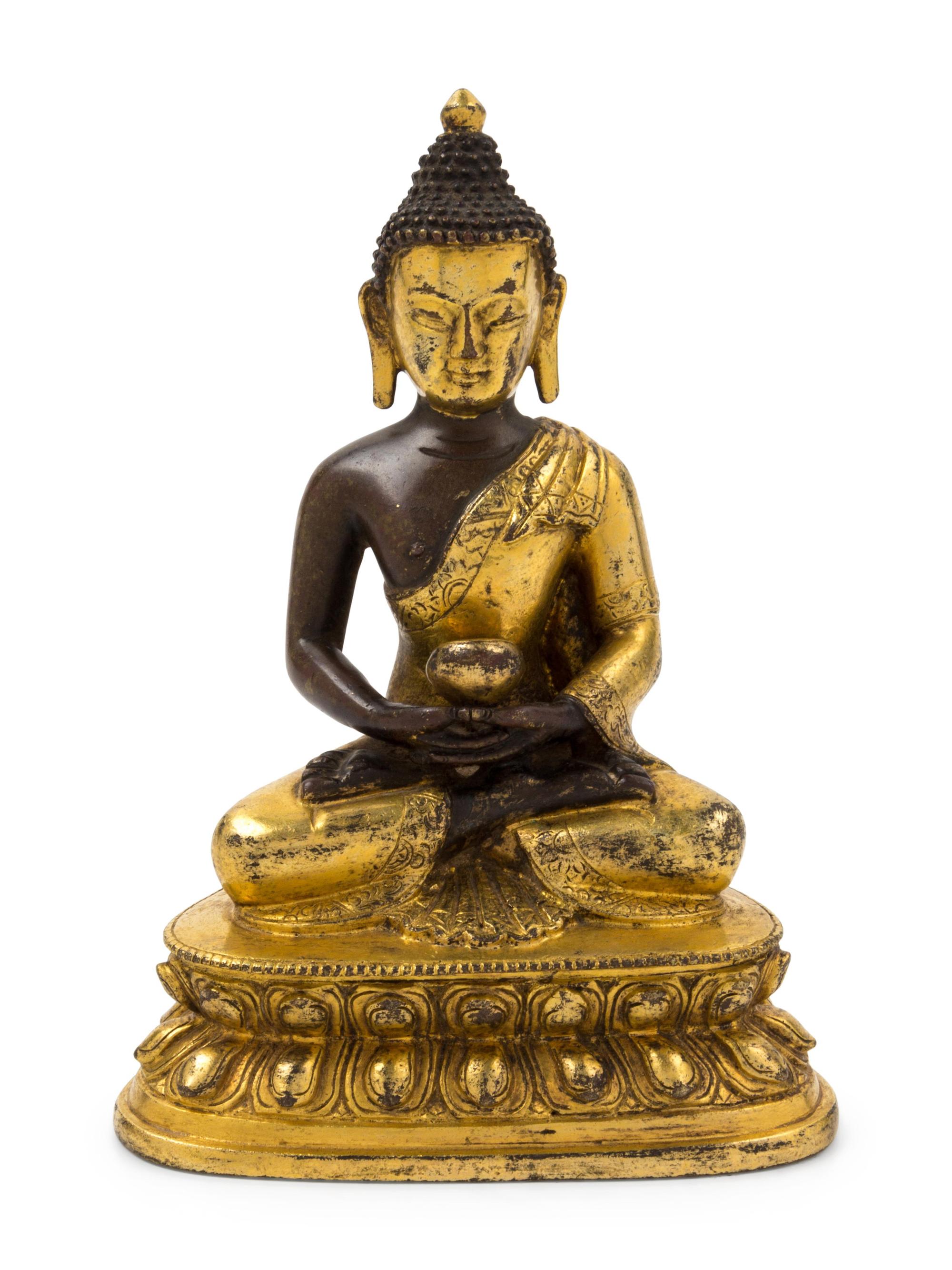 A Sino-Tibetan Gilt Bronze Figure of Medicine Buddha