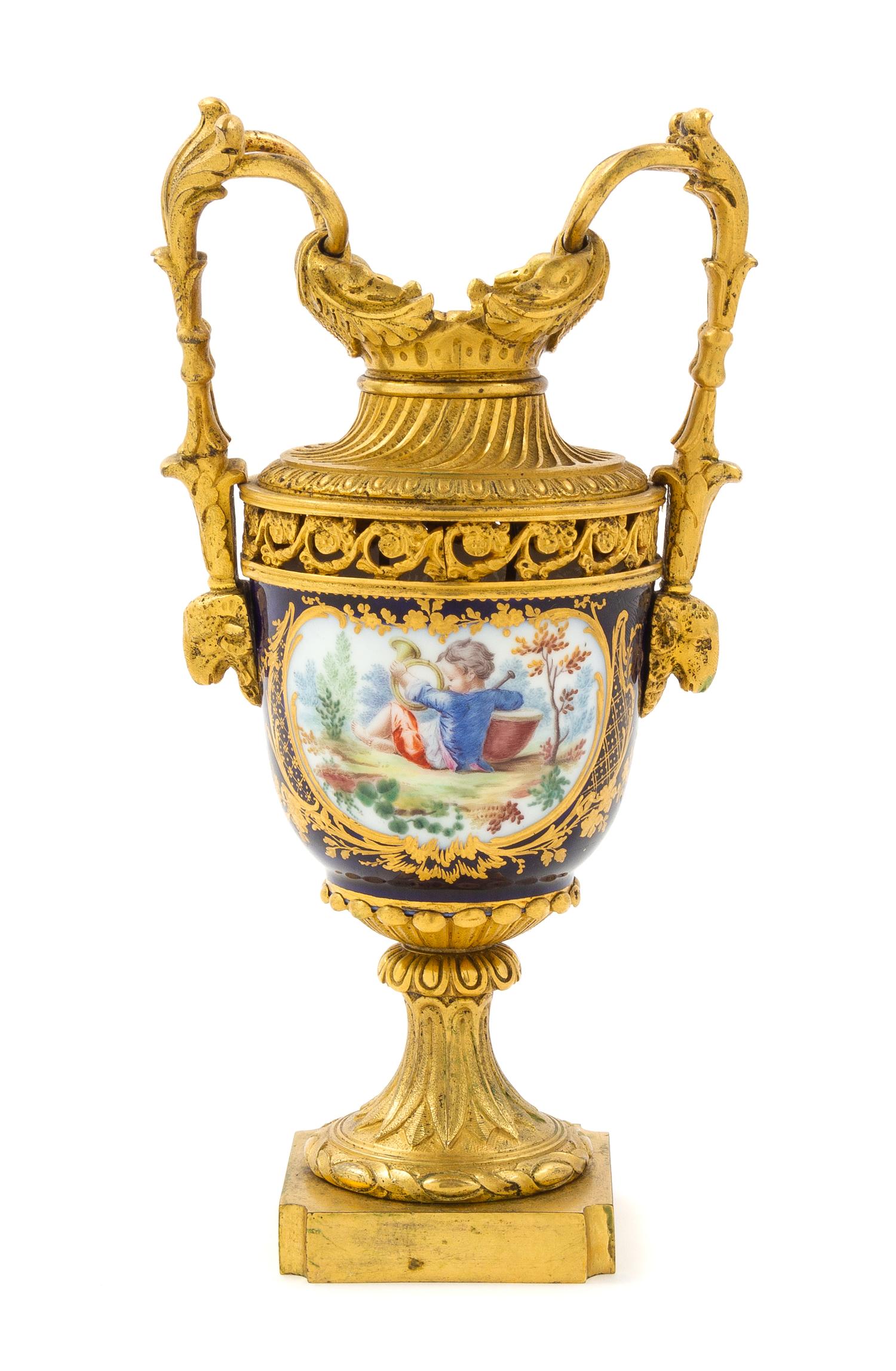 A Sevres Style Gilt Bronze Mounted Porcelain Urn Height 8 inches. — 19TH CENTURY