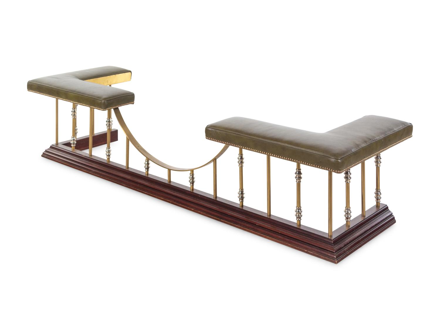 A Brass and Vinyl Upholstered Leather Club Fender