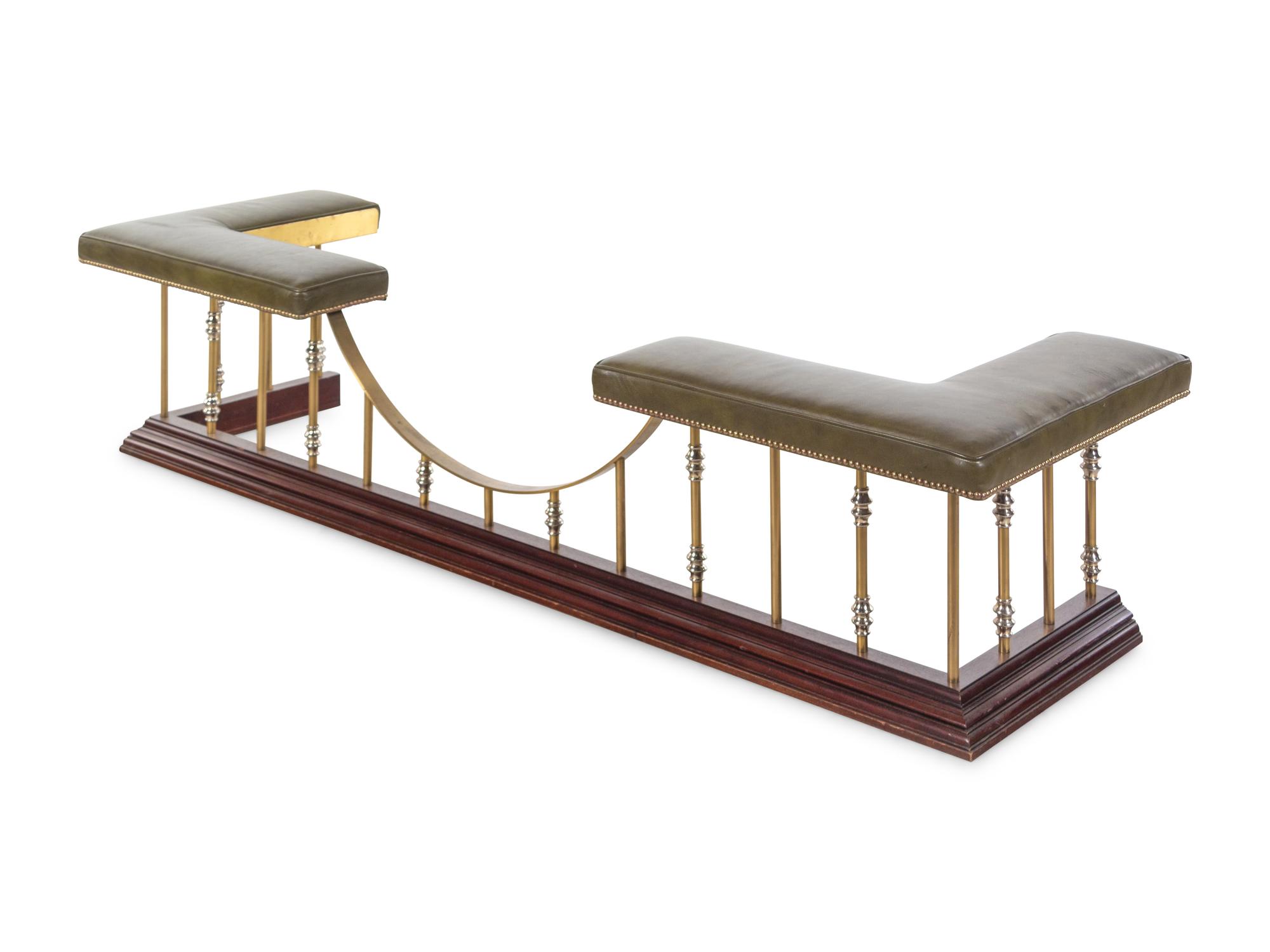 A Brass and Vinyl Upholstered Leather Club Fender