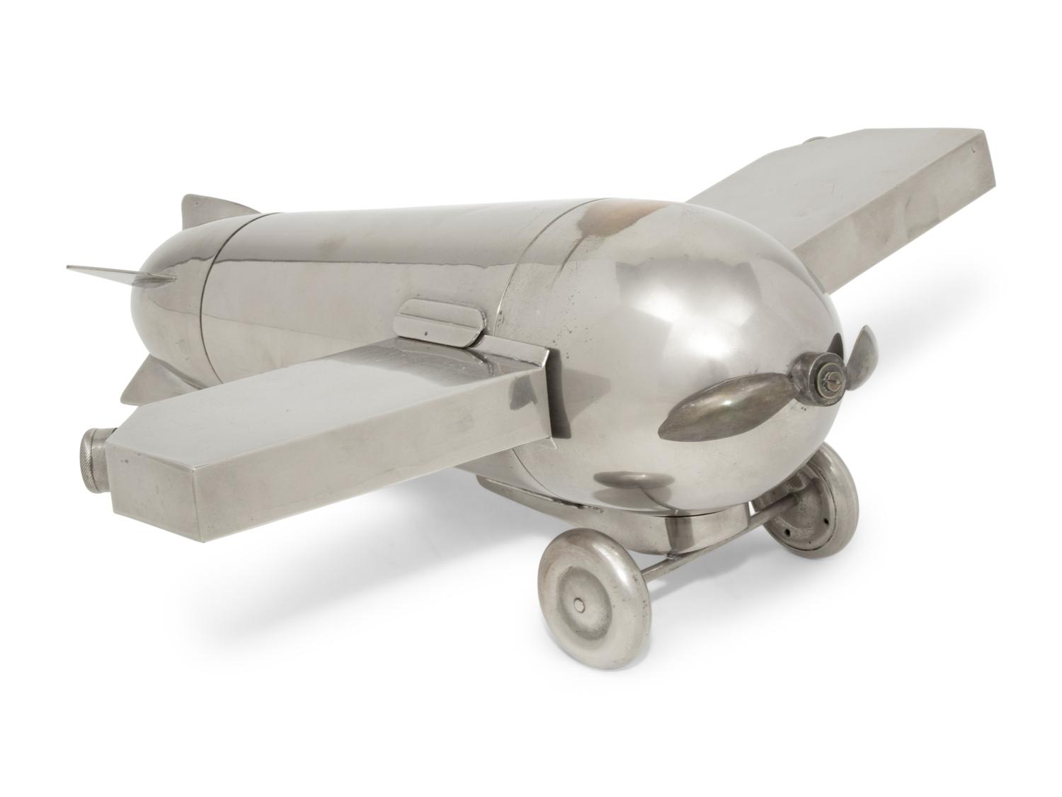 A German Chromed-Metal Airplane-Form Cocktail Shaker, Flask and Mixing Set