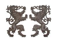 A Pair of English Cast Iron Lion Form Mounts, Height 22 inches.