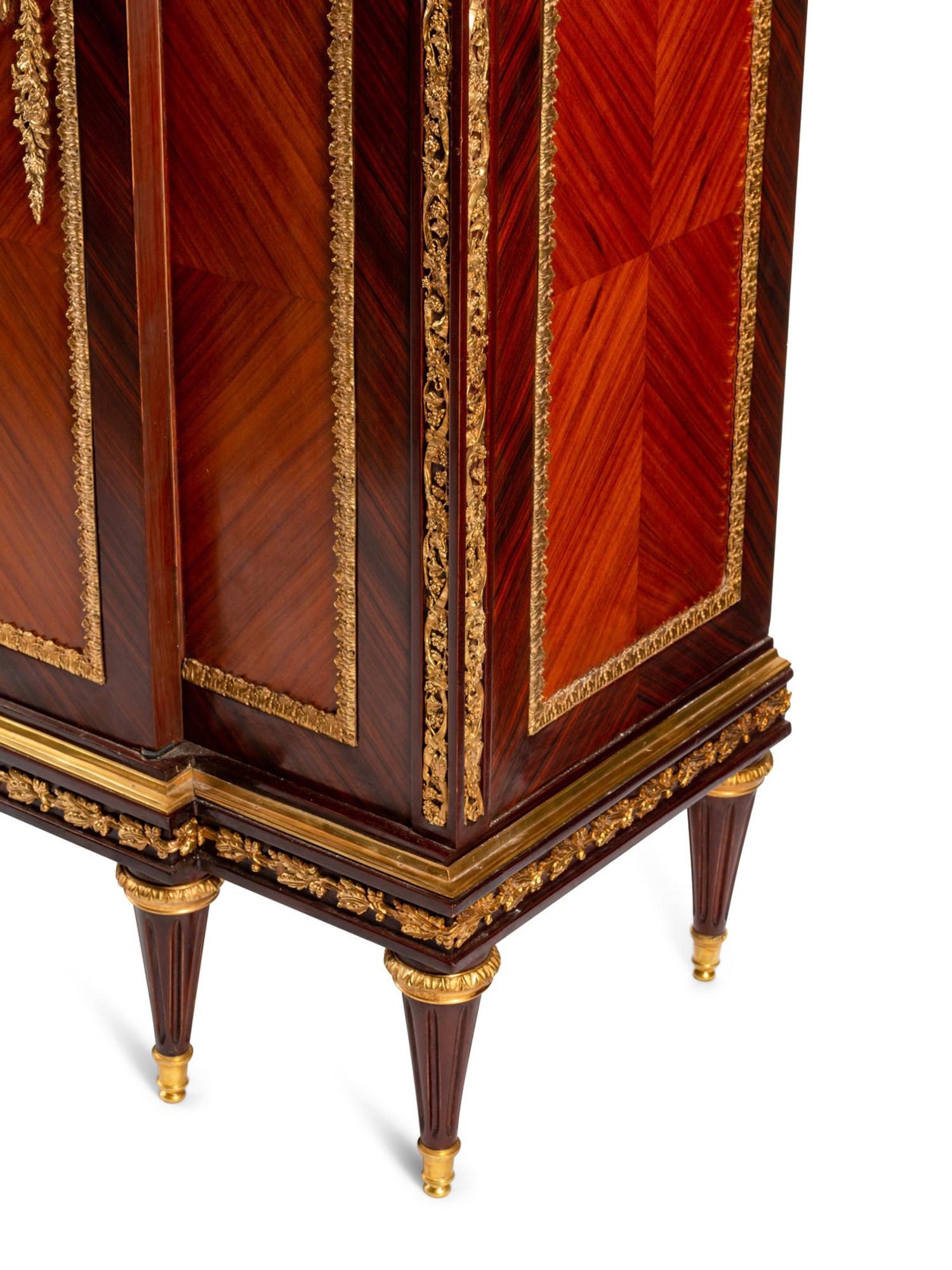 A Louis XVI Style Gilt Bronze Mounted Kingwood and Rosewood Cabinet