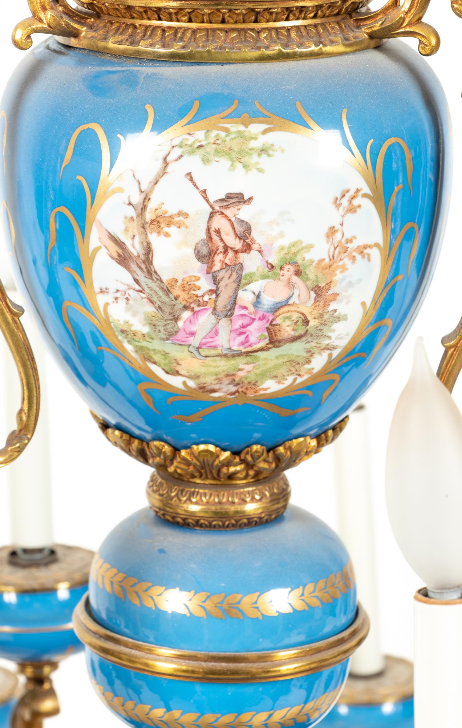 A Sèvres Style Painted Glass and Gilt Metal Mounted Eighteen-Light Chandelier