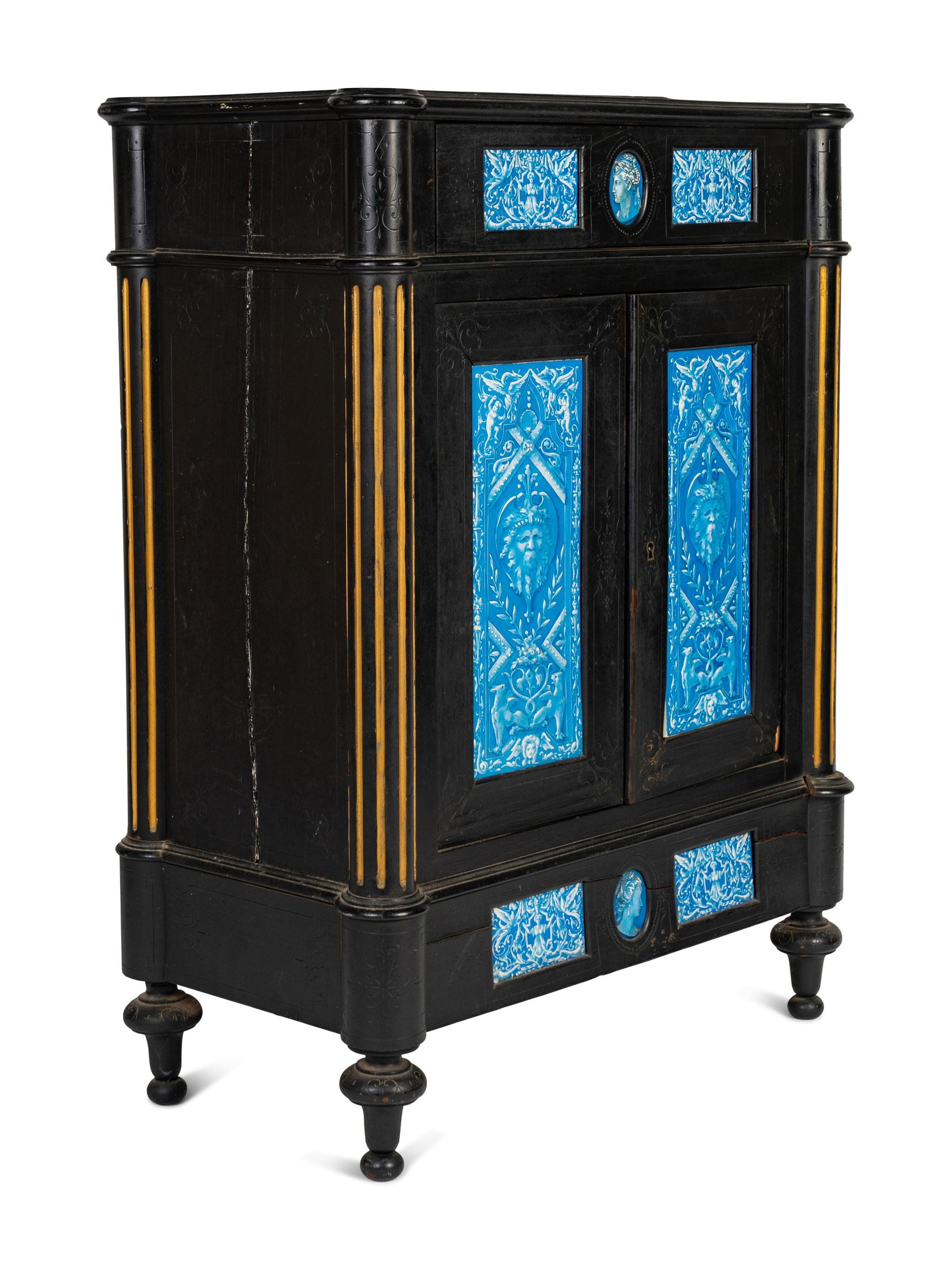 A Continental Blue Faience-Mounted Ebonized Cabinet