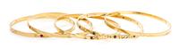 A Collection of 18 Karat Yellow Gold, Diamond, Ruby and Sapphire Bangle Bracelets, 61.80 dwts.