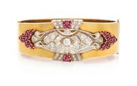 A Platinum and Rose Gold Ruby and Diamond Bangle Bracelet, 29.40 dwts.