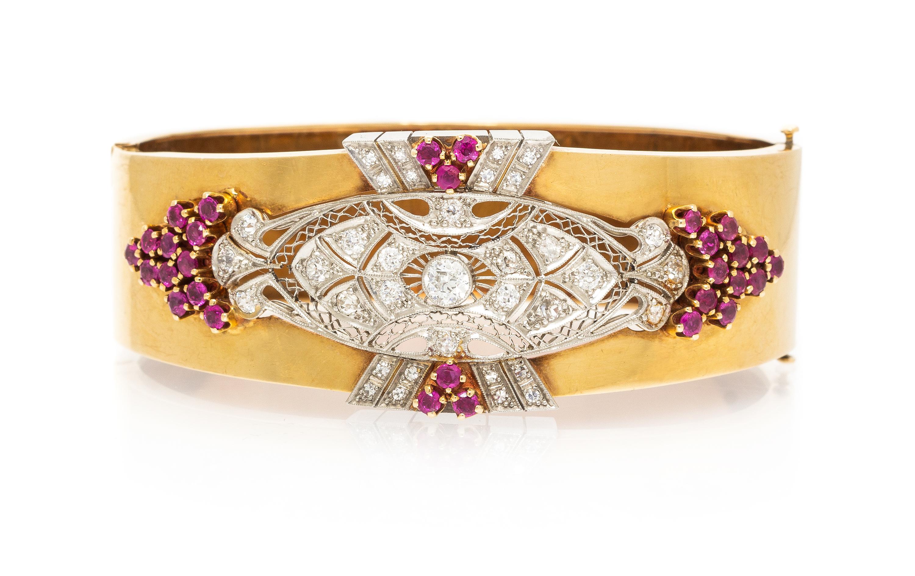 A Platinum and Rose Gold Ruby and Diamond Bangle Bracelet, 29.40 dwts.