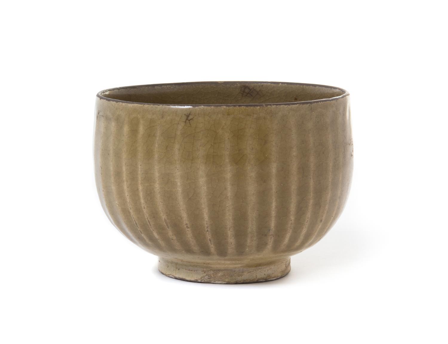 A Chinese Green Glazed Stoneware Bowl Height 3 1/4 inches.