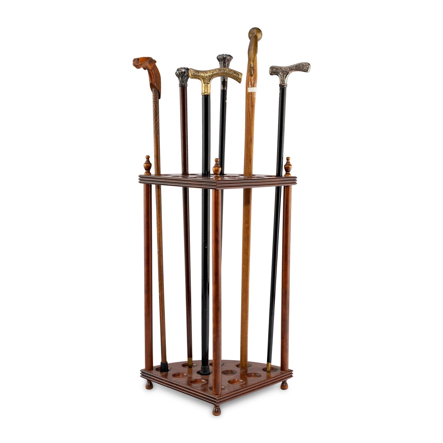 A Collection of Six Gentleman's Walking Sticks with Stand