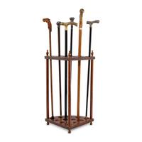 A Collection of Six Gentleman's Walking Sticks with Stand