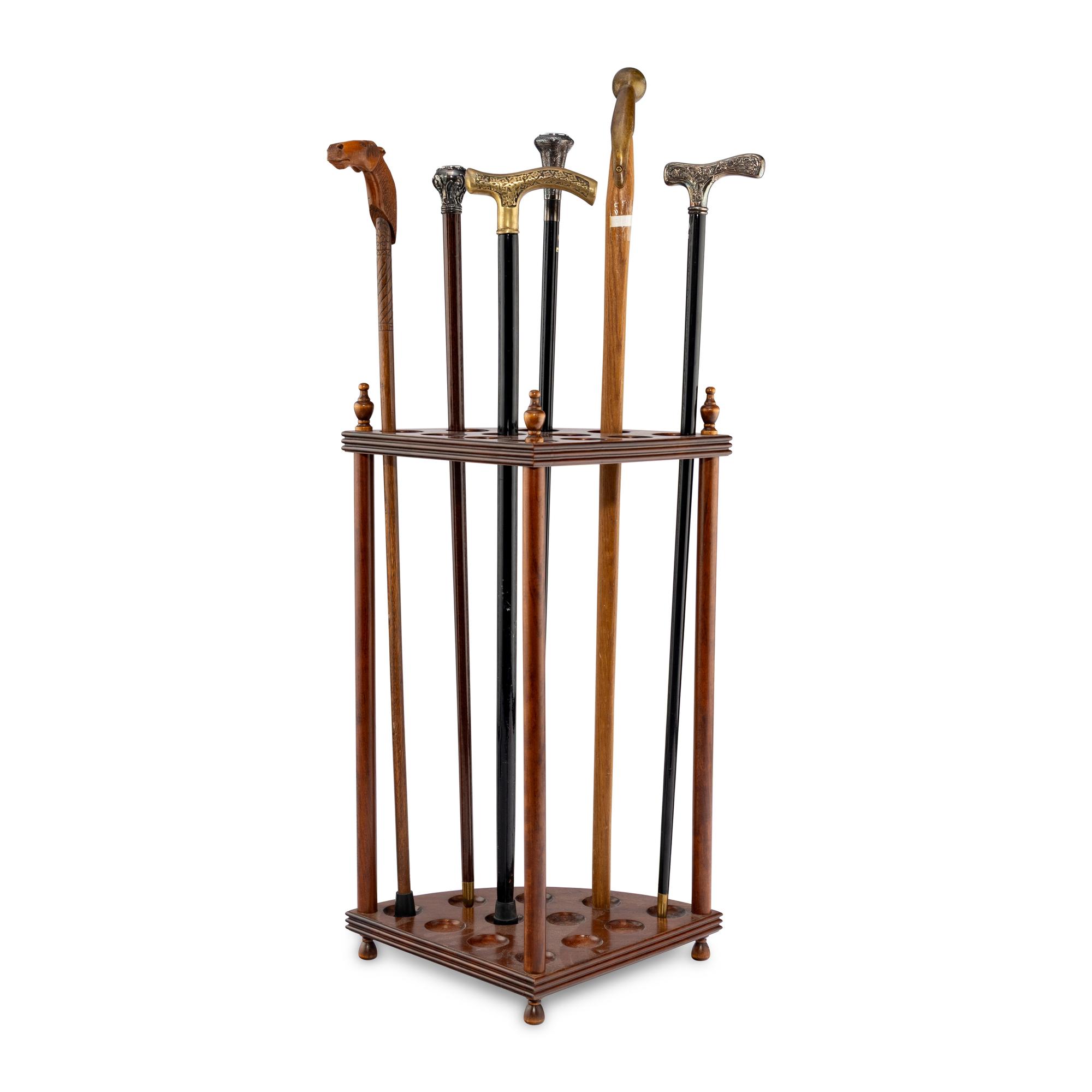 A Collection of Six Gentleman's Walking Sticks with Stand