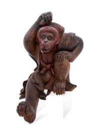 A Carved Wood Figure of a Monkey