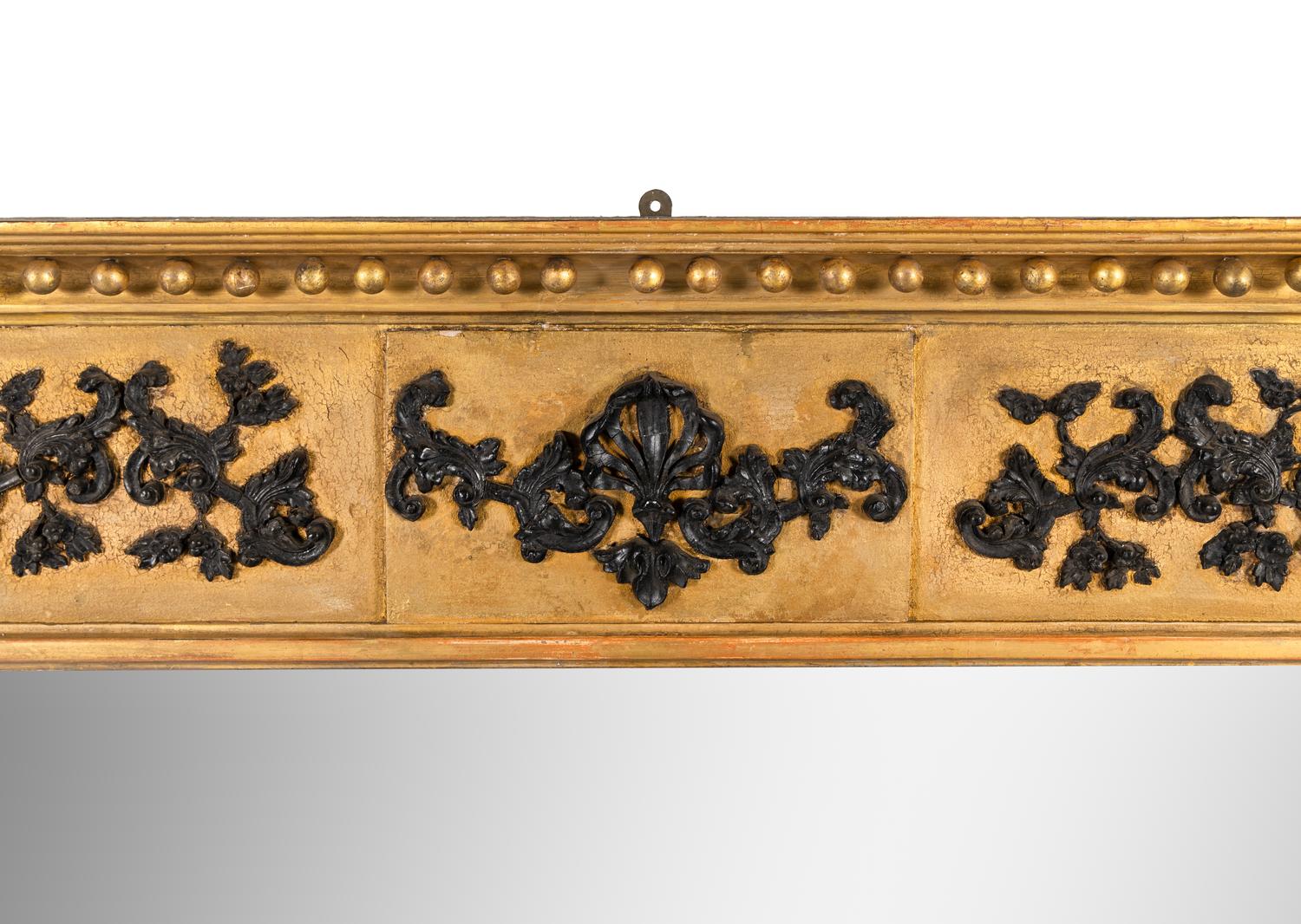 A Classical Gilt and Part Ebonized Overmantel Looking Glass