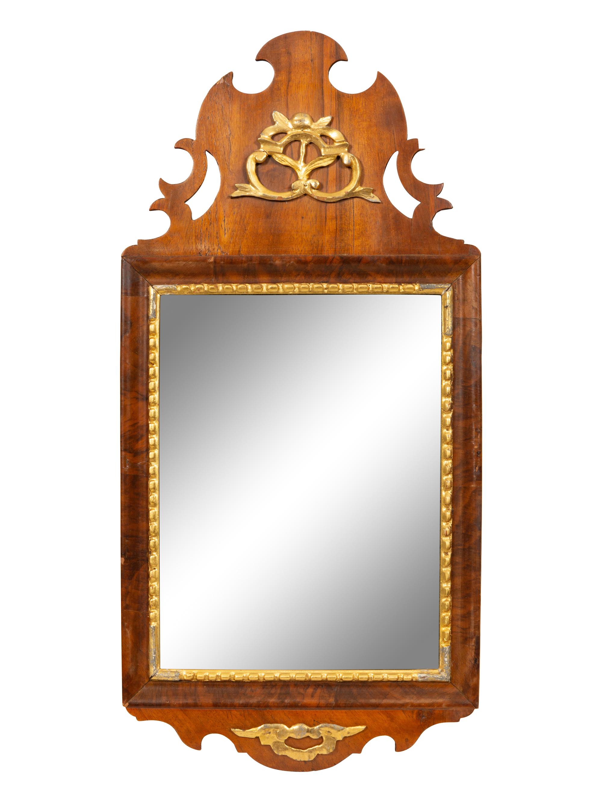 A George III Parcel Gilt Mahogany Mirror