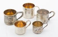 A Collection of Silver Baby Cups Height of first 1 3/4 inches.