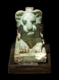 An Egyptian Faience Recumbent Lion