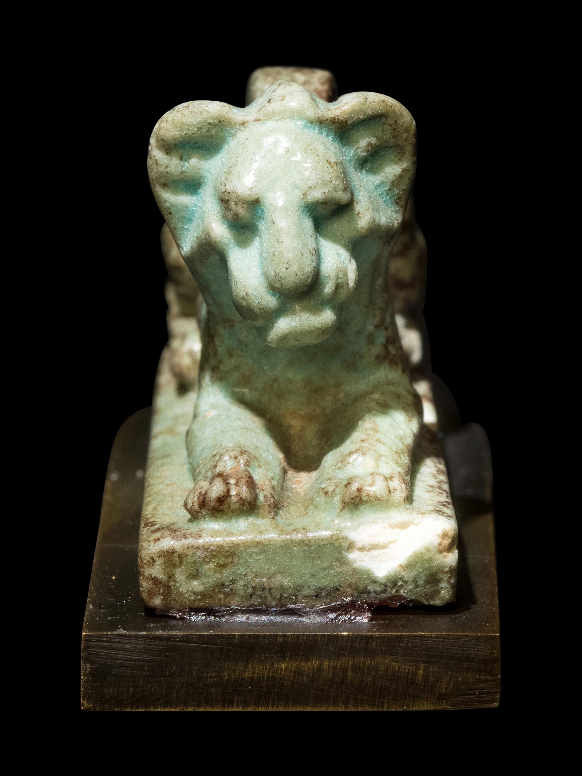 An Egyptian Faience Recumbent Lion