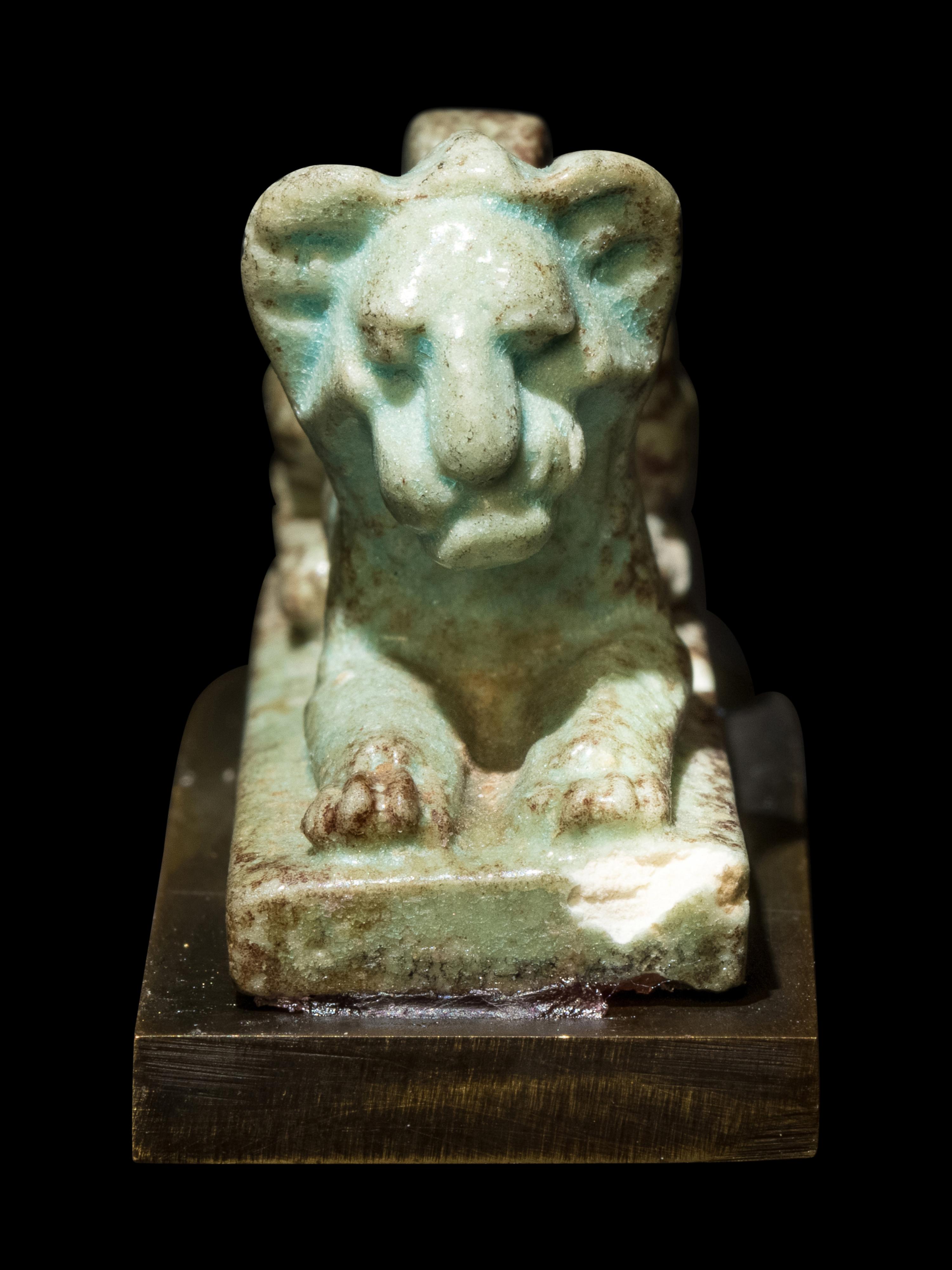 An Egyptian Faience Recumbent Lion