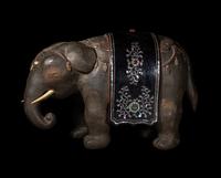 A Japanese Mother-of-Pearl Inlaid Lacquered Wood Okimono of an Elephant