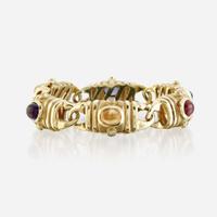 A fourteen karat gold and gem-set bracelet