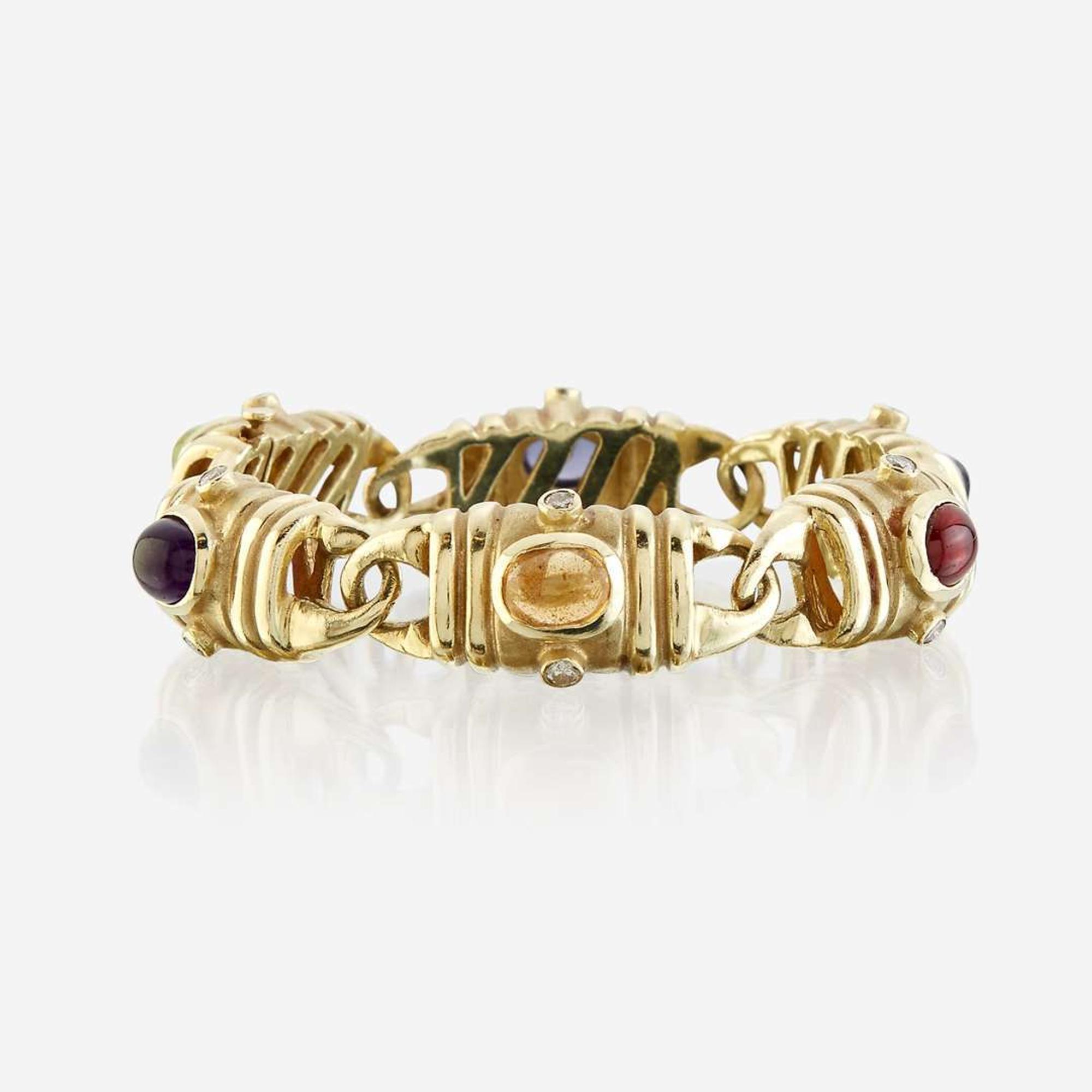 A fourteen karat gold and gem-set bracelet