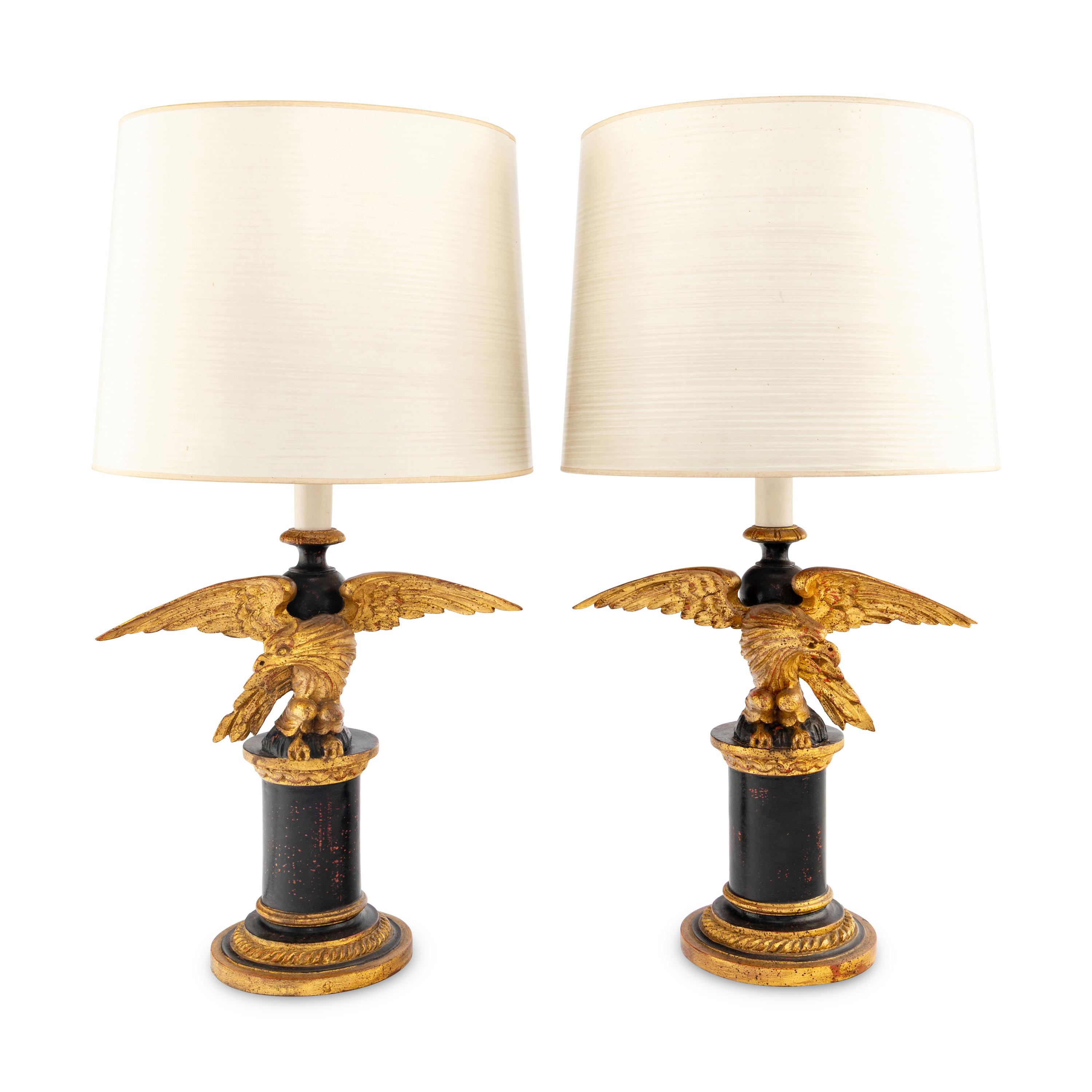 A Pair of Painted and Parcel Gilt Eagle-Form Lamps