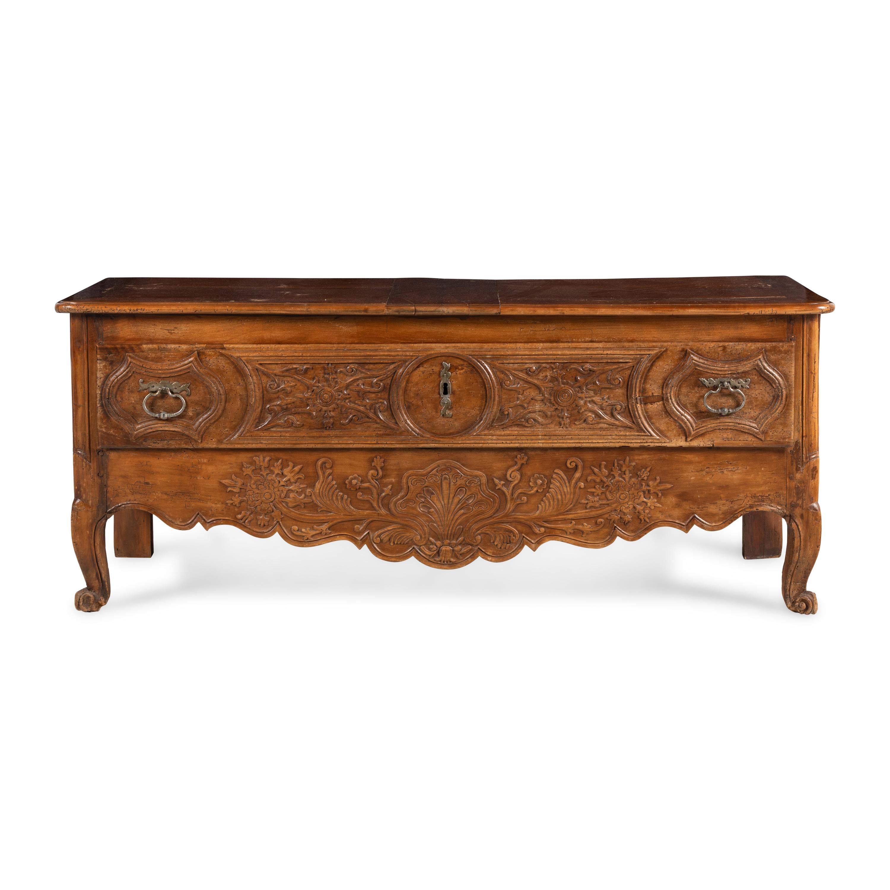A French Provincial Carved Walnut Lift-Top Chest
