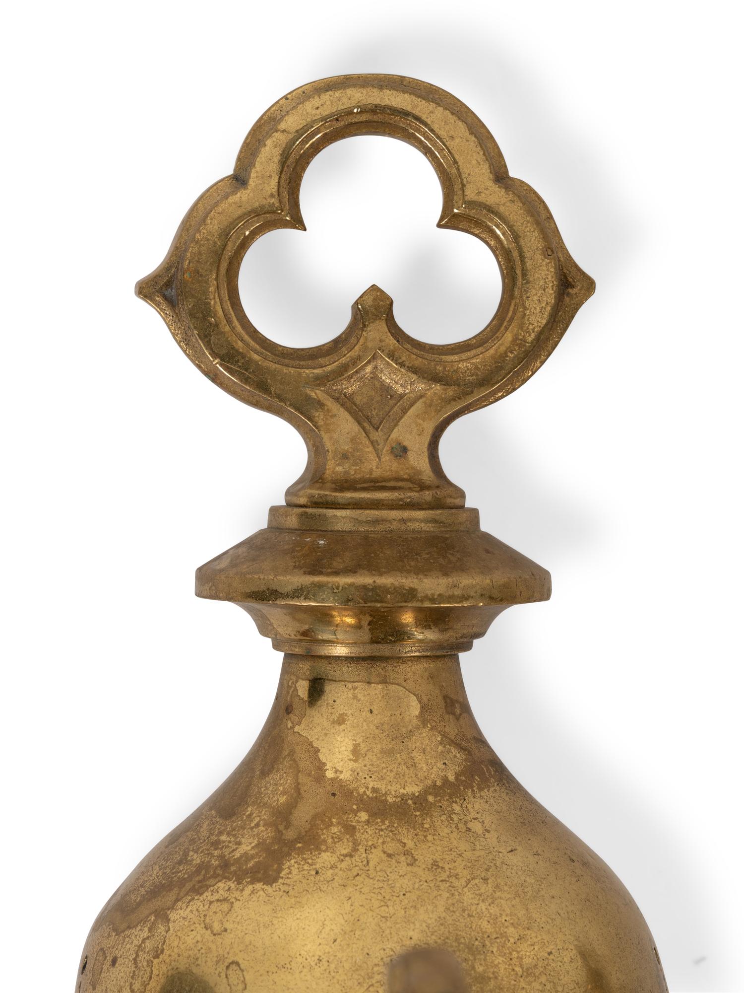 A Pair of Gothic Style Brass Three-Light Sconces