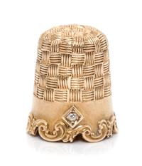 An American 14-Karat Yellow Gold and Diamond Thimble, Goldsmith, Stern & Co., New York, NY, the top and body with an engine turned weav
