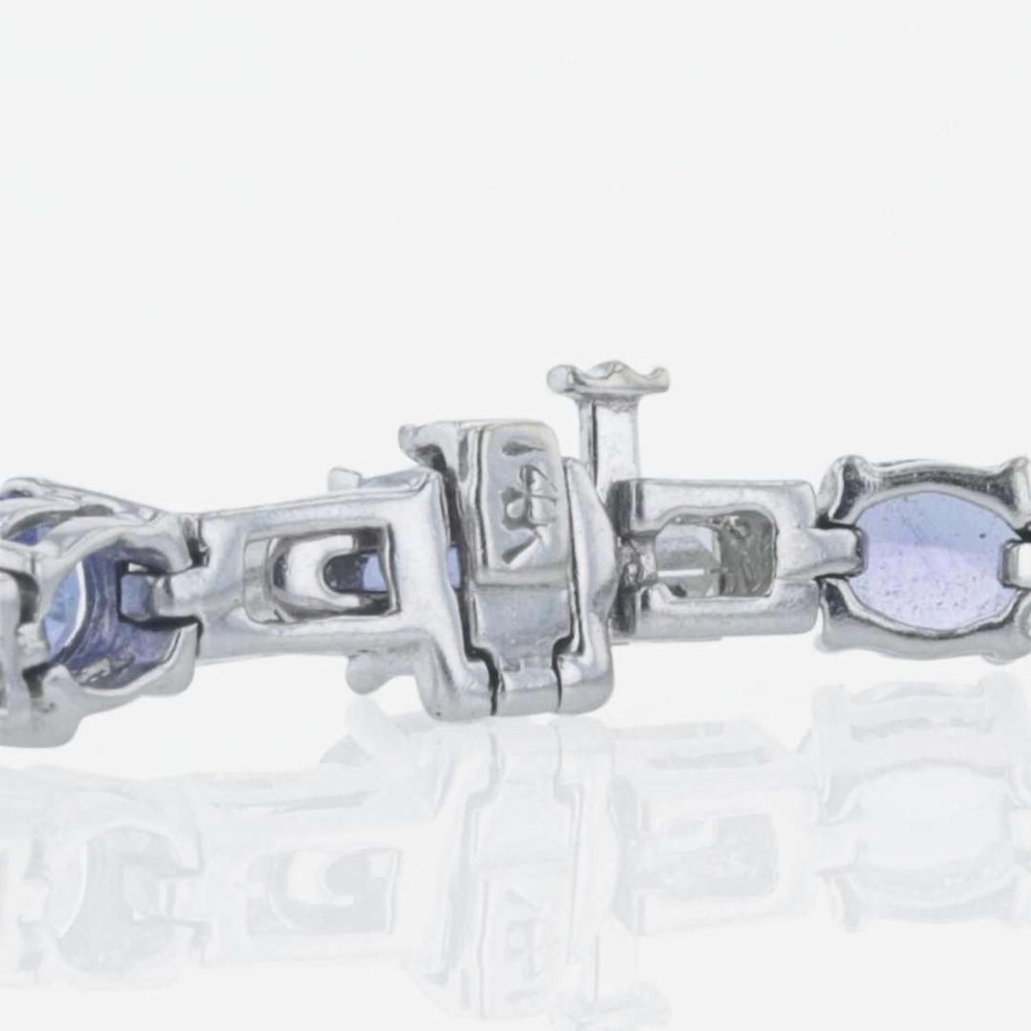 A 14K white gold, tanzanite, and diamond bracelet