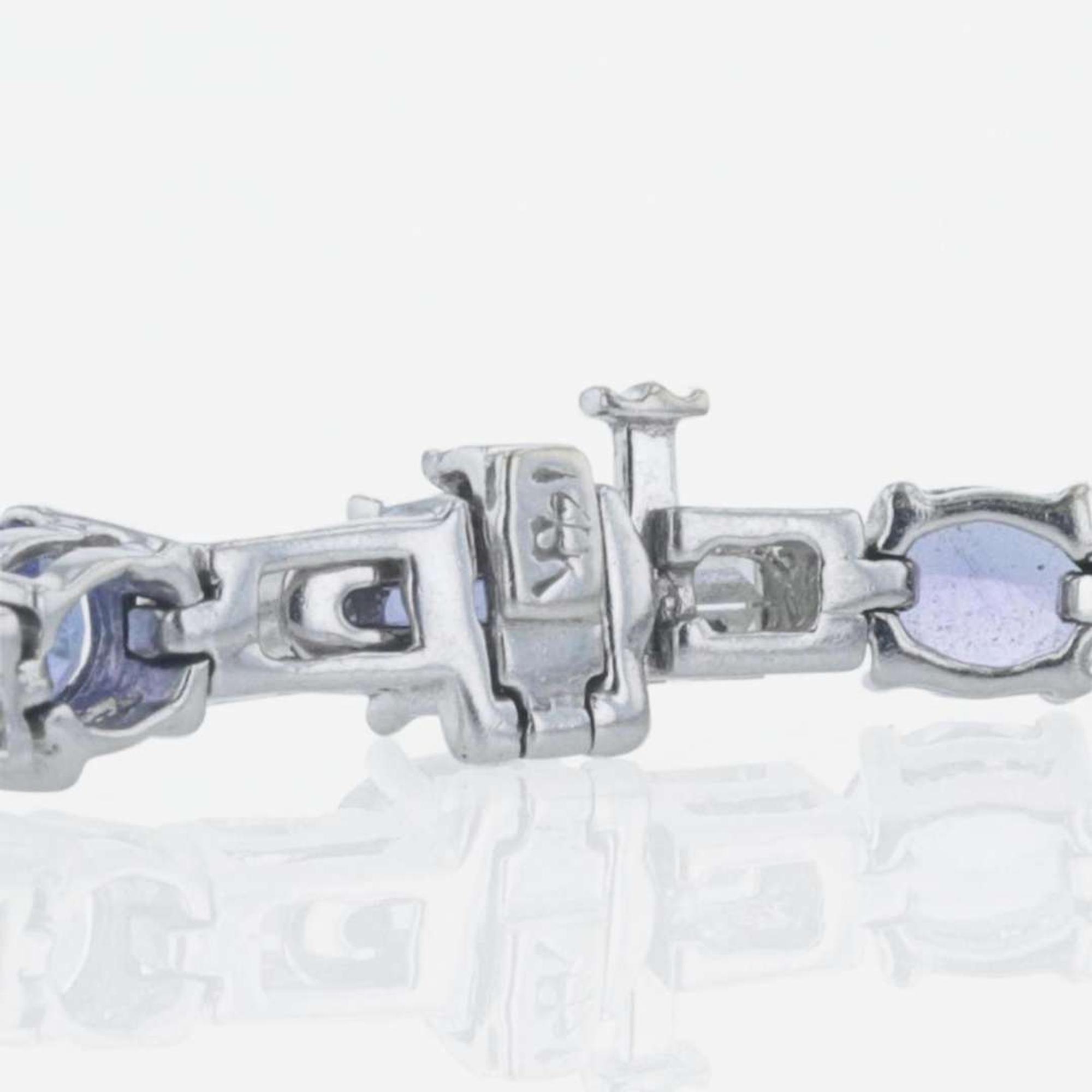 A 14K white gold, tanzanite, and diamond bracelet