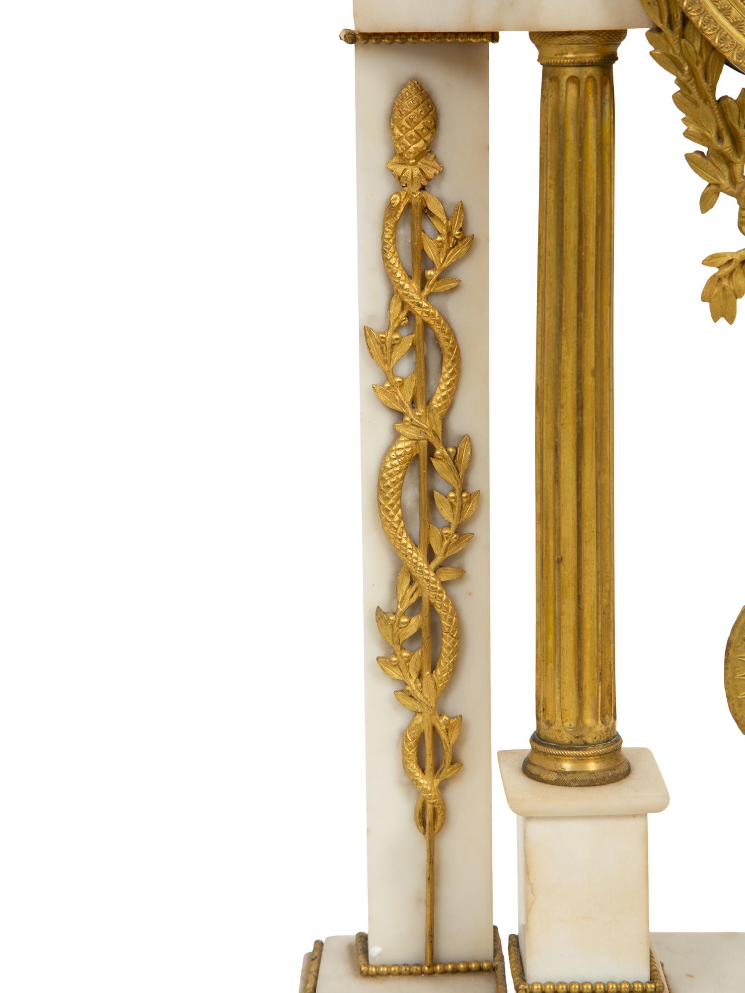 A French Gilt Bronze and White Marble Mantel Clock