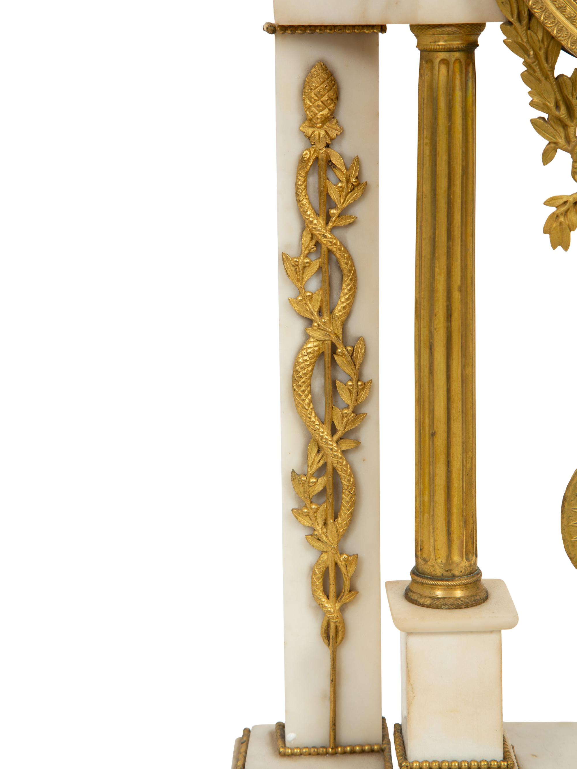 A French Gilt Bronze and White Marble Mantel Clock